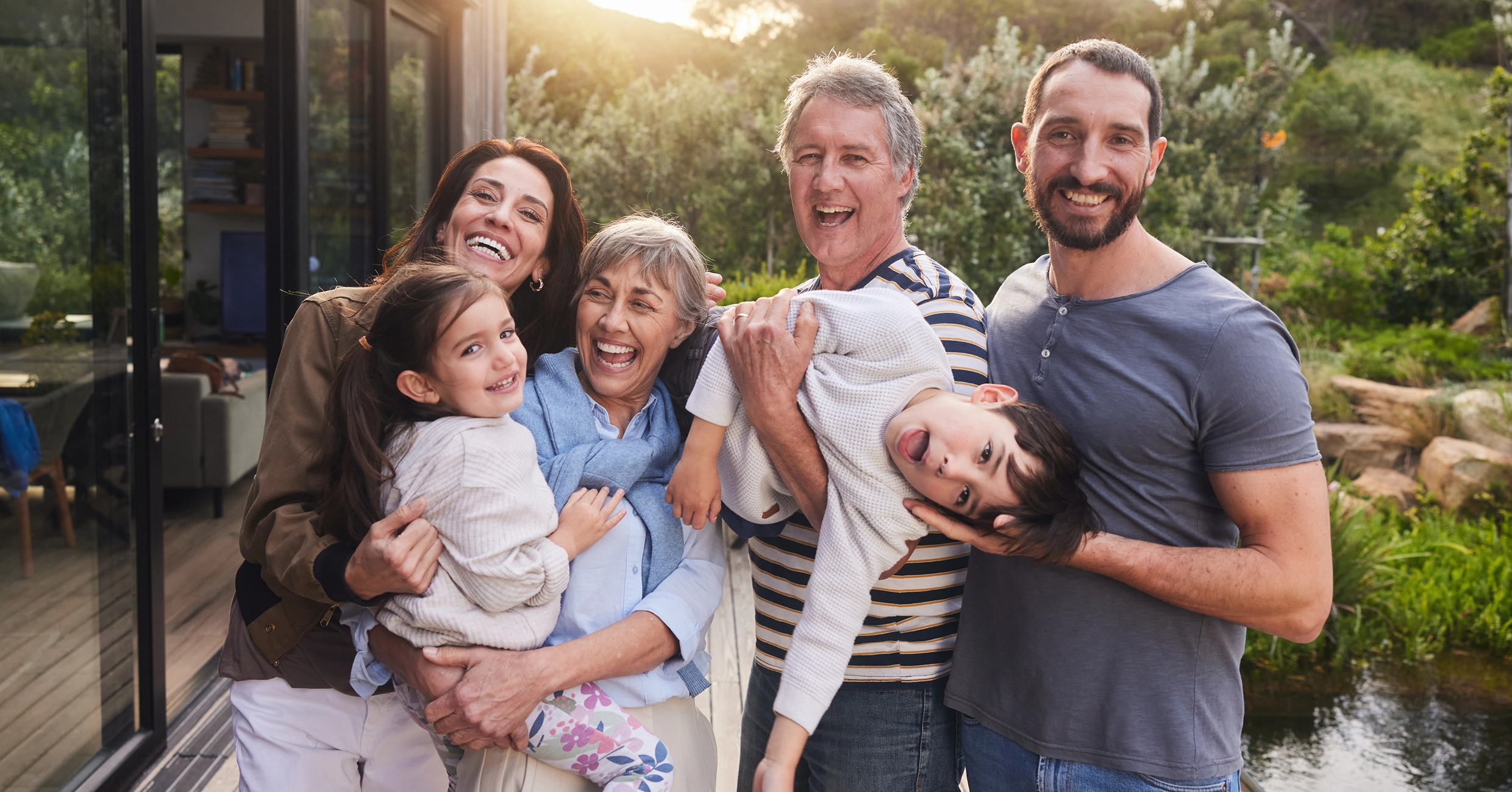 Happy family posing together outdoors.